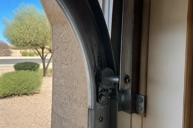 2-inch residential garage door rollers installed in metal tracks at a home in Phoenix, AZ.