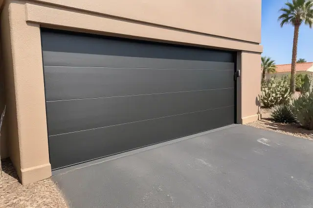 Aluminum garage doors with horizontal panels installed on a home driveway in Phoenix, AZ.