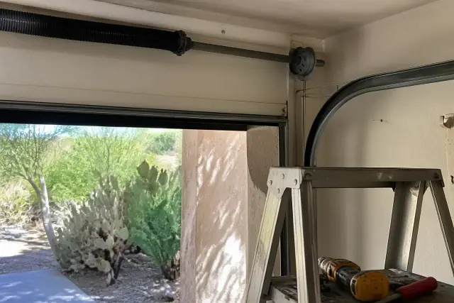 New steel lifting cables installed on a garage door system at a home in Scottsdale, AZ.