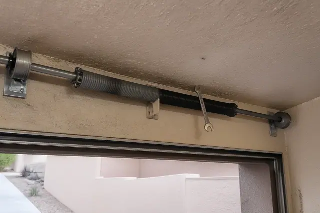 Torsion springs and cable drums on a garage door being maintained in Chandler, AZ.