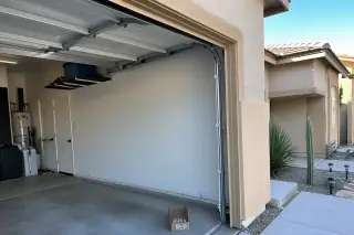New nylon rollers installed in a garage door track at a home in Phoenix, AZ.