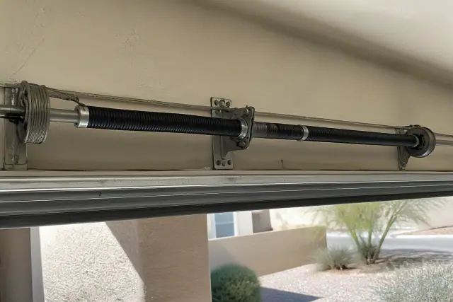 New torsion spring and hardware installed on a garage door in Goodyear, AZ.