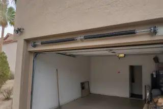 New garage door torsion springs and cable drums installed on a residential home in Phoenix, AZ.