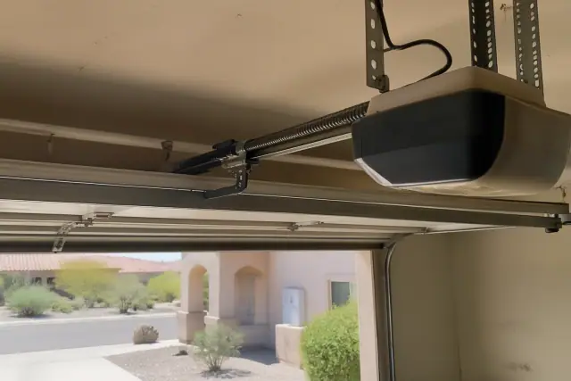 Screw-drive garage door opener installed on a residential ceiling in Phoenix, AZ.