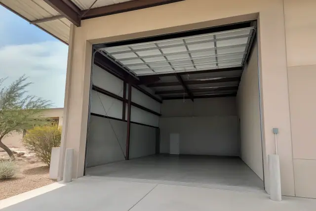 Sectional commercial door installation in an industrial warehouse bay in Phoenix, AZ.