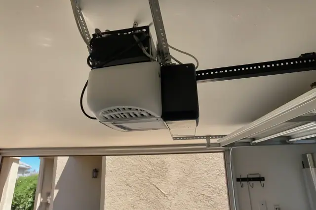 Smart garage door opener with battery backup installed on a ceiling in Phoenix, AZ.