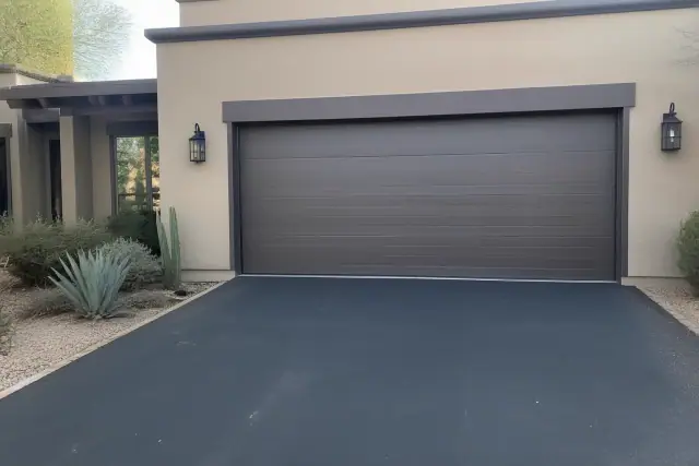 Wood composite garage door installed on a residential home in Phoenix, AZ.