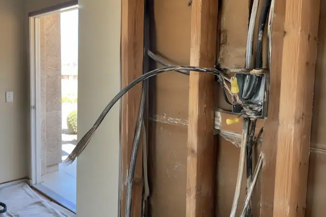 Old aluminum wiring being extracted and spliced in an exposed wall in Glendale, AZ.