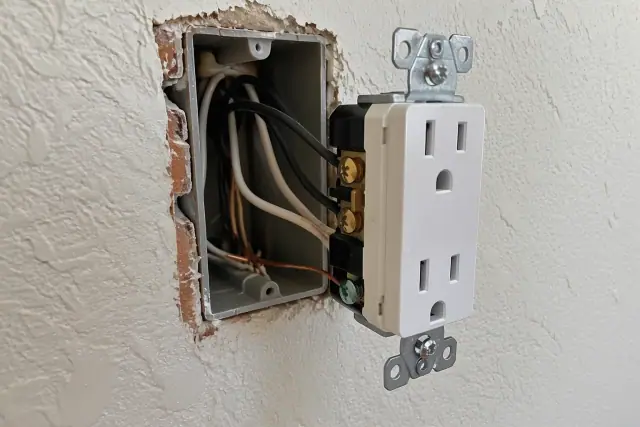 Tamper-resistant electrical receptacle wired in a residential wall in Gilbert, AZ.