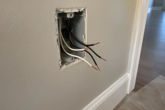 Electrical box with looped copper wires during whole house rewiring in Tempe, AZ.