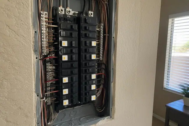 GFCI circuit breakers installed in an open wall box during a residential upgrade in Phoenix, AZ.