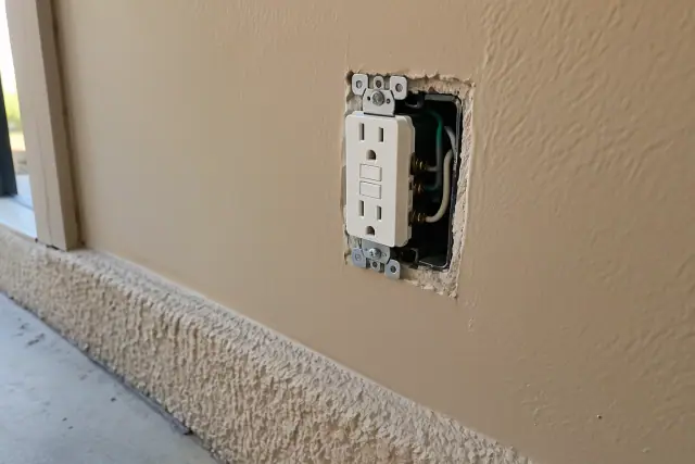 Newly installed GFCI outlet for moisture-exposed areas in Phoenix, AZ.