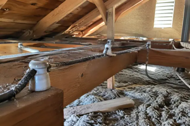 Knob and tube wiring replacement in a sunlit attic in Phoenix, AZ.