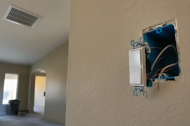 Outlet and switch installation during a whole house rewiring project in Avondale, AZ.