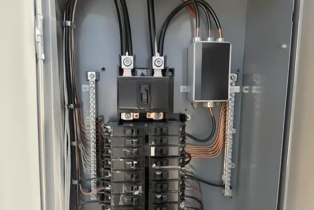 Whole-home surge protection wired to a main breaker box in Peoria, AZ.