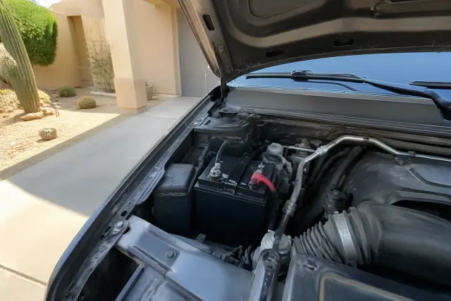 New AGM battery installed in a car engine bay at a residence in Phoenix, AZ.