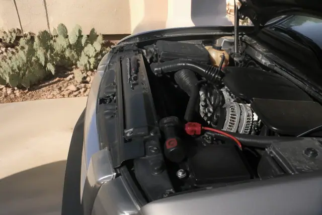 New alternator installed in a vehicle engine bay during a mobile mechanic service in Avondale, AZ.