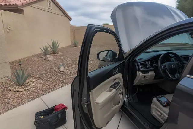OBD-II diagnostic scan on a vehicle parked on a residential driveway in Chandler, AZ.