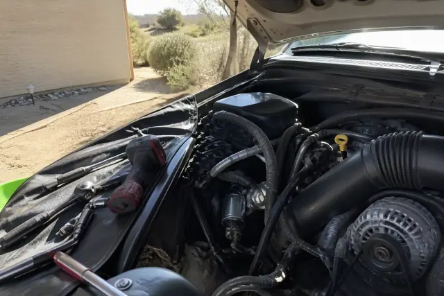 New starter installed in a vehicle engine bay at a residence in Gilbert, AZ.