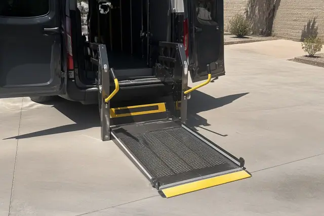 An automated hydraulic lift ramp deployed on the ground for mobility access at a work site in Phoenix, AZ.