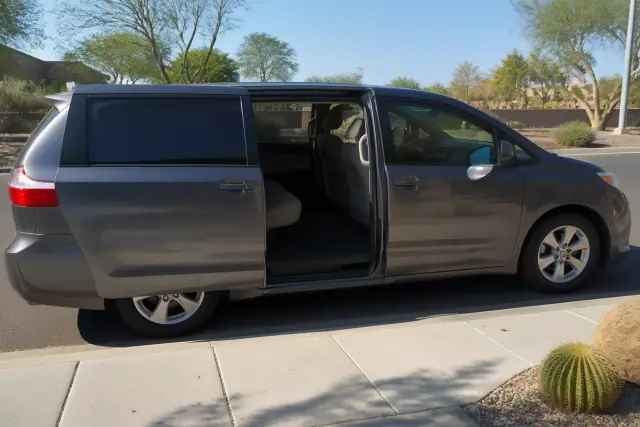 Open sliding door of a transport van parked curbside for hospital discharge in Phoenix, AZ.