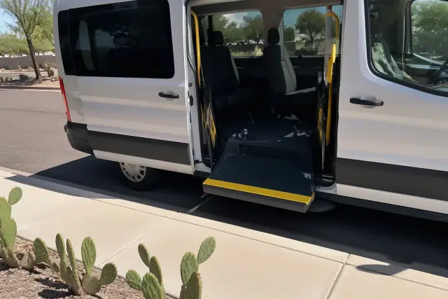 Open sliding door of an ambulatory medical transport vehicle parked curbside in Chandler, AZ.