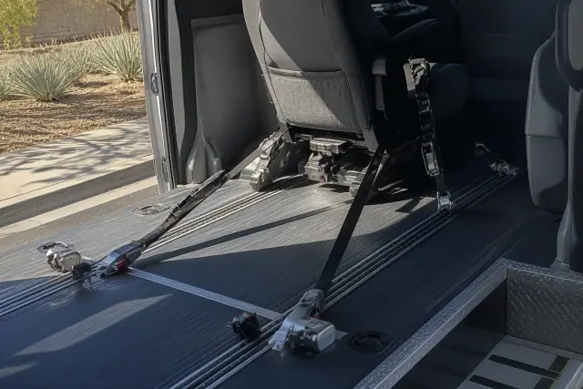 Interior of a dialysis transport vehicle with floor tracking and wheelchair tie-downs in Phoenix, AZ.