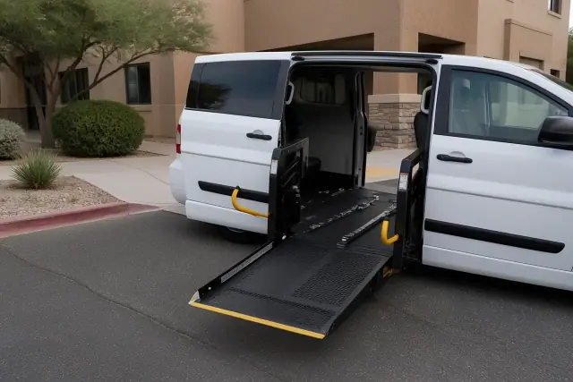 Wheelchair van with a lowered hydraulic lift parked at a dialysis clinic in Gilbert, AZ.