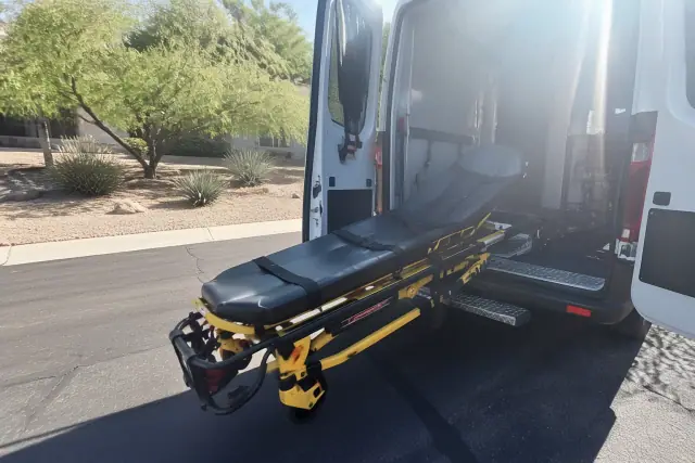 Stretcher secured in a medical transport vehicle during a dialysis pickup in Phoenix, AZ.