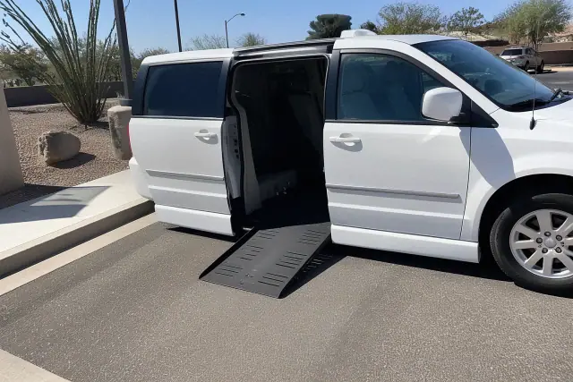 Medical transport van parked curbside with sliding doors open for boarding in Peoria, AZ.