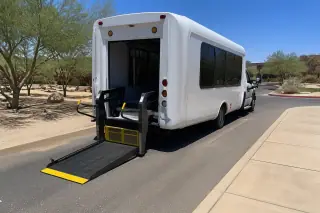 Hydraulic lift ramp deployed for wheelchair access on a transport van in Phoenix, AZ.