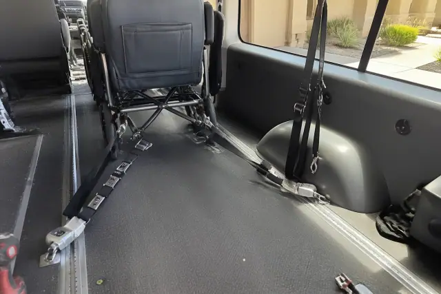 Four-point wheelchair securement system installed in a vehicle floor in Phoenix, AZ.