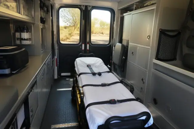 Interior of a medical transport ambulance with a secured stretcher and equipment in Chandler, AZ.