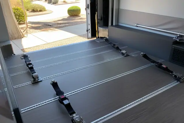 Four-point wheelchair tie-down straps installed in a medical transport vehicle in Gilbert, AZ.