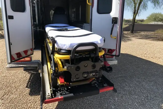 Stretcher and bariatric loading equipment with safety belts secured at a jobsite in Phoenix, AZ.