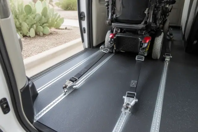 Wheelchair tie-down straps secured to a mobility device in a transport vehicle in Phoenix, AZ.