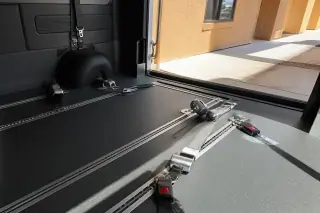 Interior floor tracks and securement straps installed in a wheelchair transport van in Phoenix, AZ.