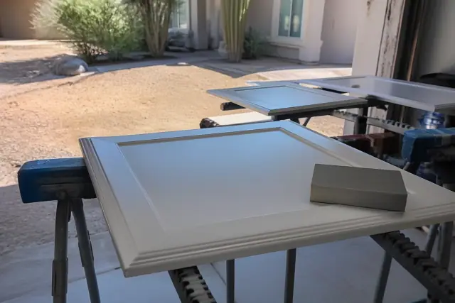 Cabinet doors drying on racks during a painting project at a jobsite in Peoria, AZ.