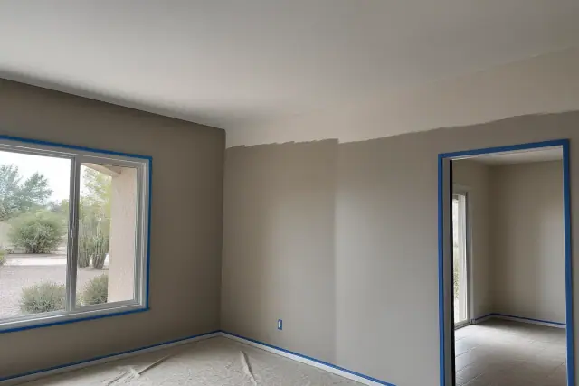Freshly painted living room walls and popcorn ceiling removal in progress at a home in Phoenix, AZ.