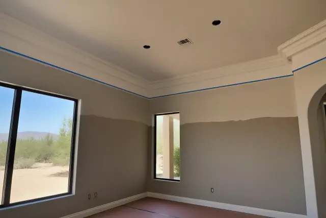Living room with high ceilings and detailed crown molding in Phoenix, AZ.