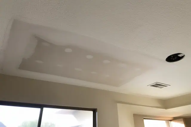 Sanded drywall patch on a ceiling ready for primer in a Phoenix, AZ home.