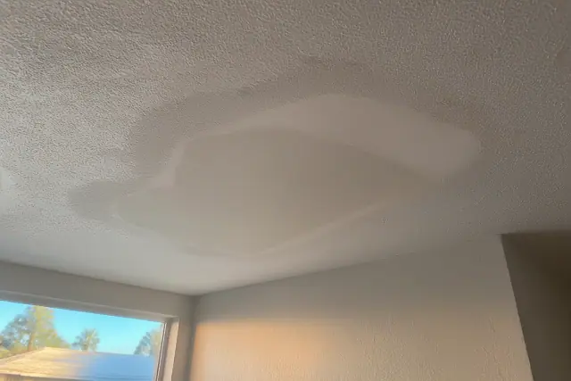 Sanded drywall patch on a ceiling being prepared for paint in a home in Phoenix, AZ.