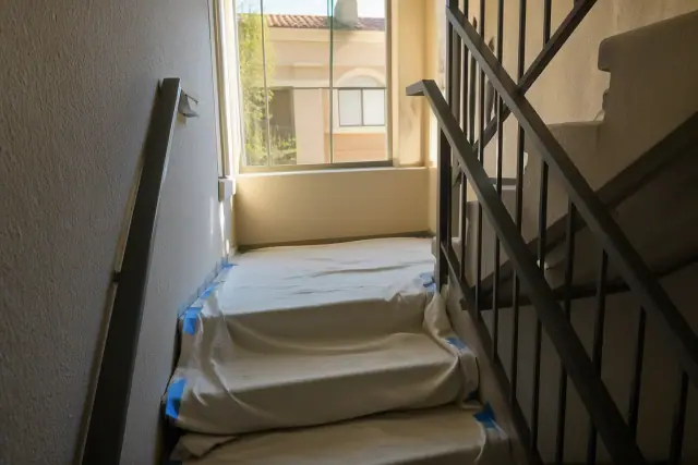 Drop cloths and maintenance markers in a multifamily stairwell during a project in Phoenix, AZ.