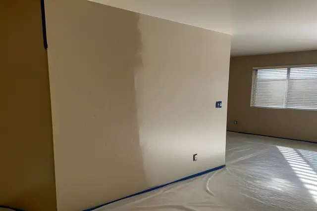 Freshly painted wall showing a color transition in a residential living space in Phoenix, AZ.