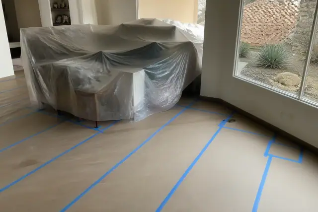 Heavy-duty floor protection covering tile in a residential room during a project in Phoenix, AZ.