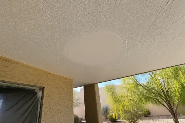 Sanded drywall patch on a textured ceiling for a repair project in Phoenix, AZ.