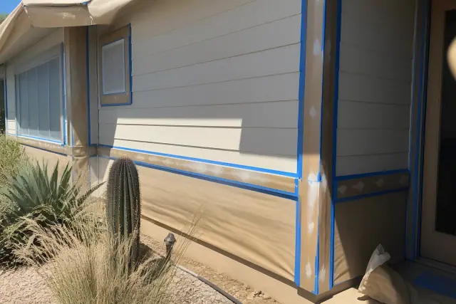 Wood siding and trim during exterior painting prep with painter's tape and wood filler at a jobsite in Phoenix, AZ.