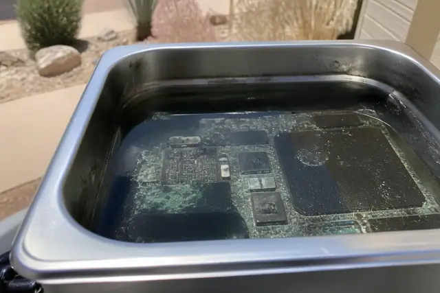 Circuit board with salt water corrosion and mineral crusting being cleaned in Phoenix, AZ.