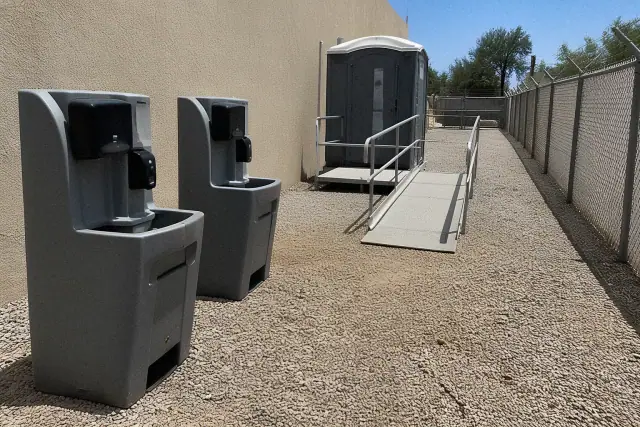 ADA-compliant portable toilet and handwashing station on a gravel path in Phoenix, AZ.
