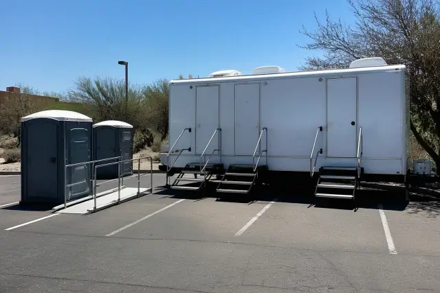 ADA-compliant luxury restroom trailer parked on an asphalt lot in Phoenix, AZ.